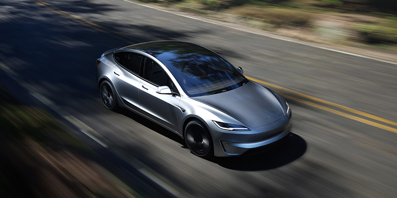 Silver Tesla Model 3 Exterior Front Driving