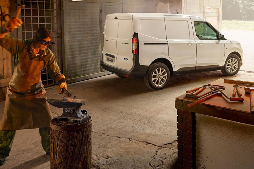 White Ford Transit Courier in Blacksmiths Workshop