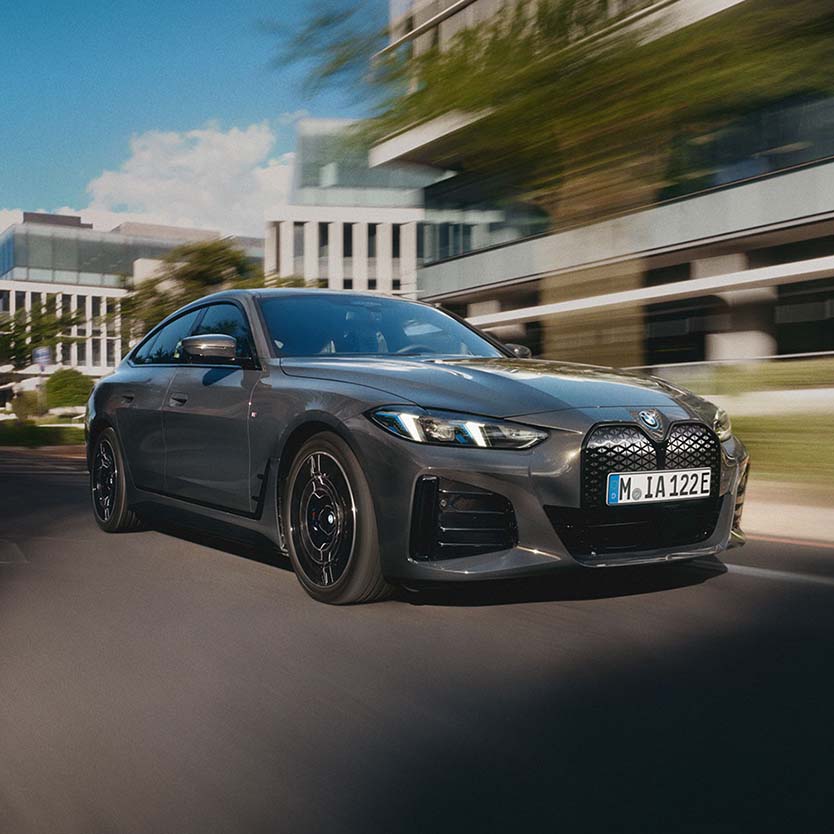 Black BMW i4 Exterior Driving in City