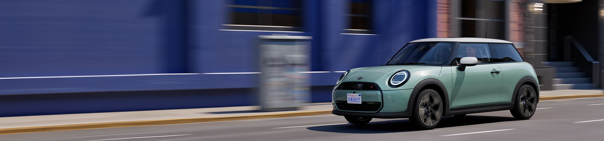 Blue MINI Cooper Exterior Driving in Urban Area